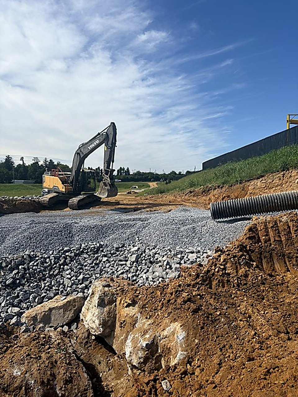 Drainage: laying pipe in a stone trench