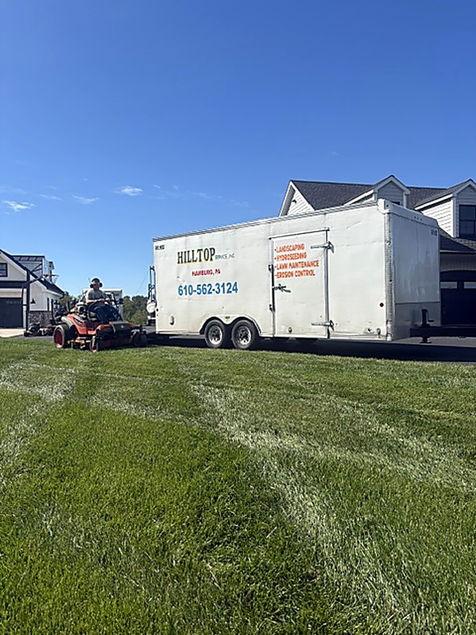 Mowing: a Hilltop crew and trailer on the job