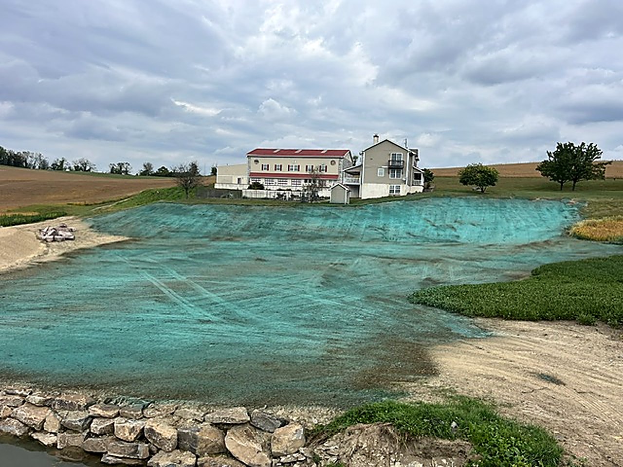 Erosion control: seeded pond banks with stone
