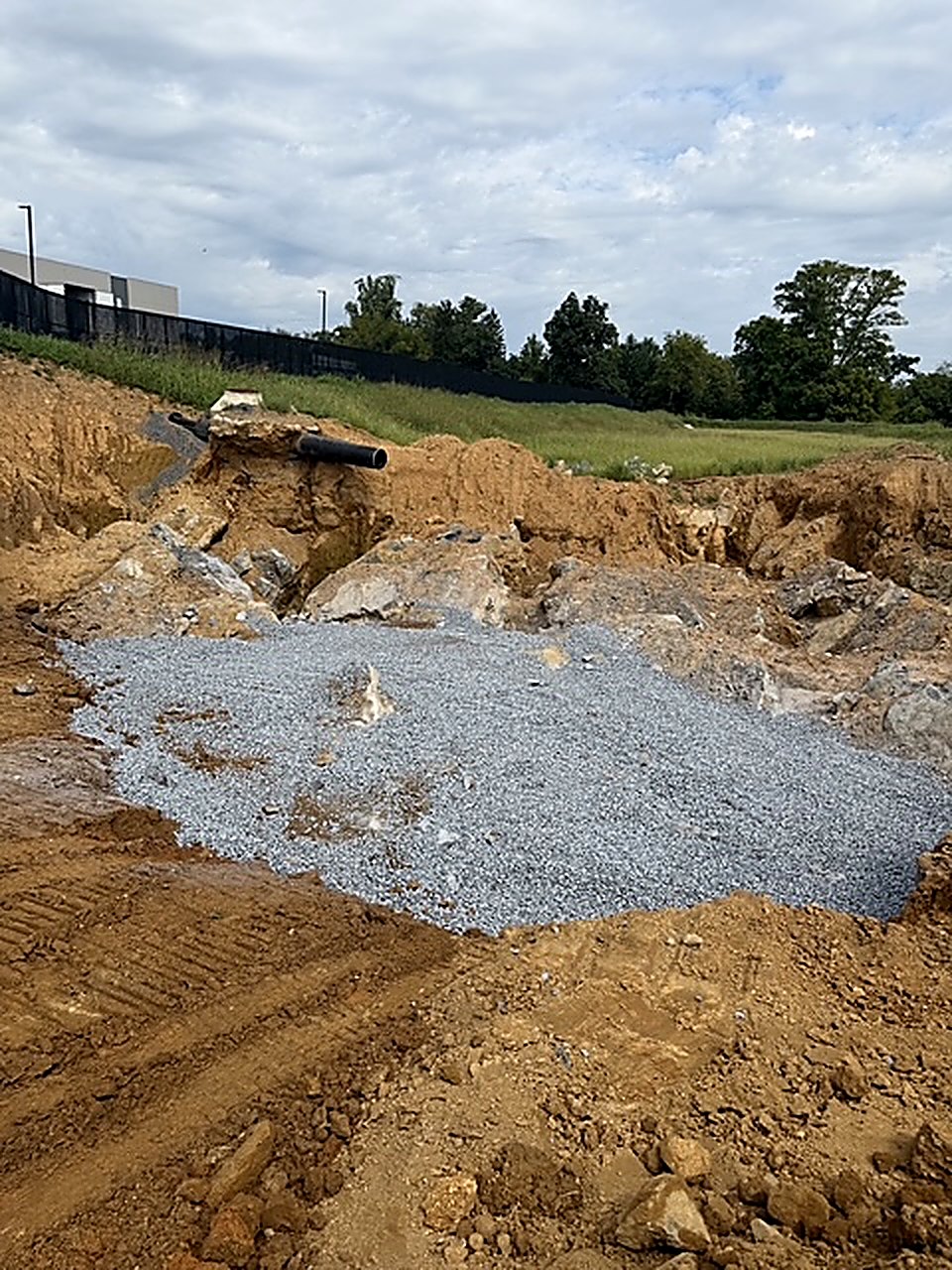 Excavation: a stone base going in